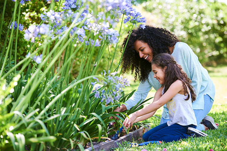 A mother and daughter in the garden